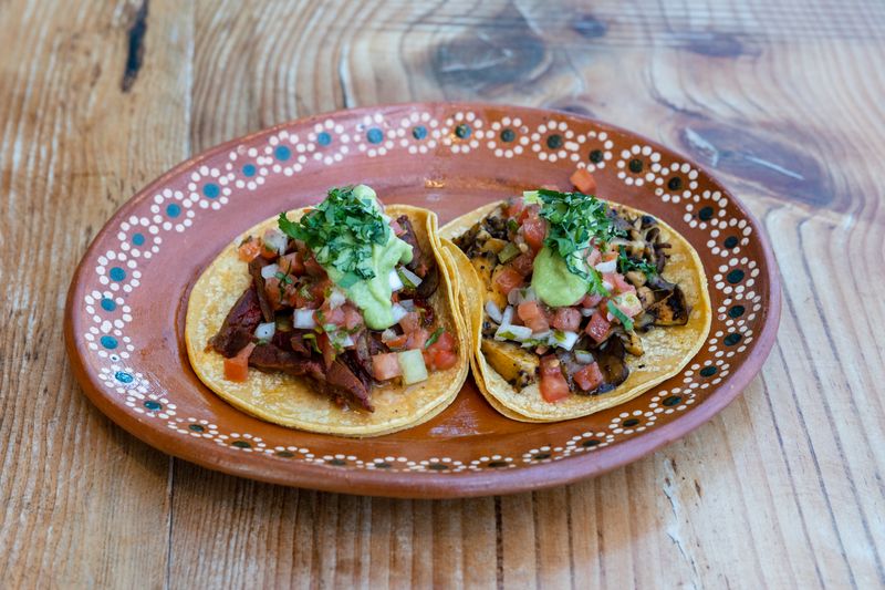 Grilled carne asada street tacos with fresh onion and cilantro