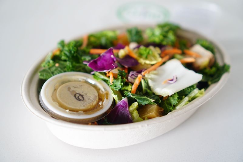 Coastal kale salad with avocado and lemon tahini dressing