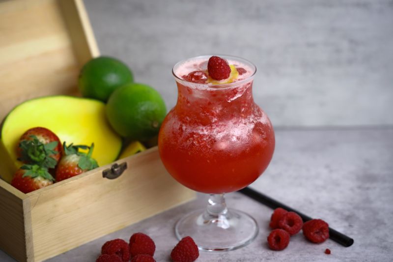 Mango chili lemonade drink with tajin rim